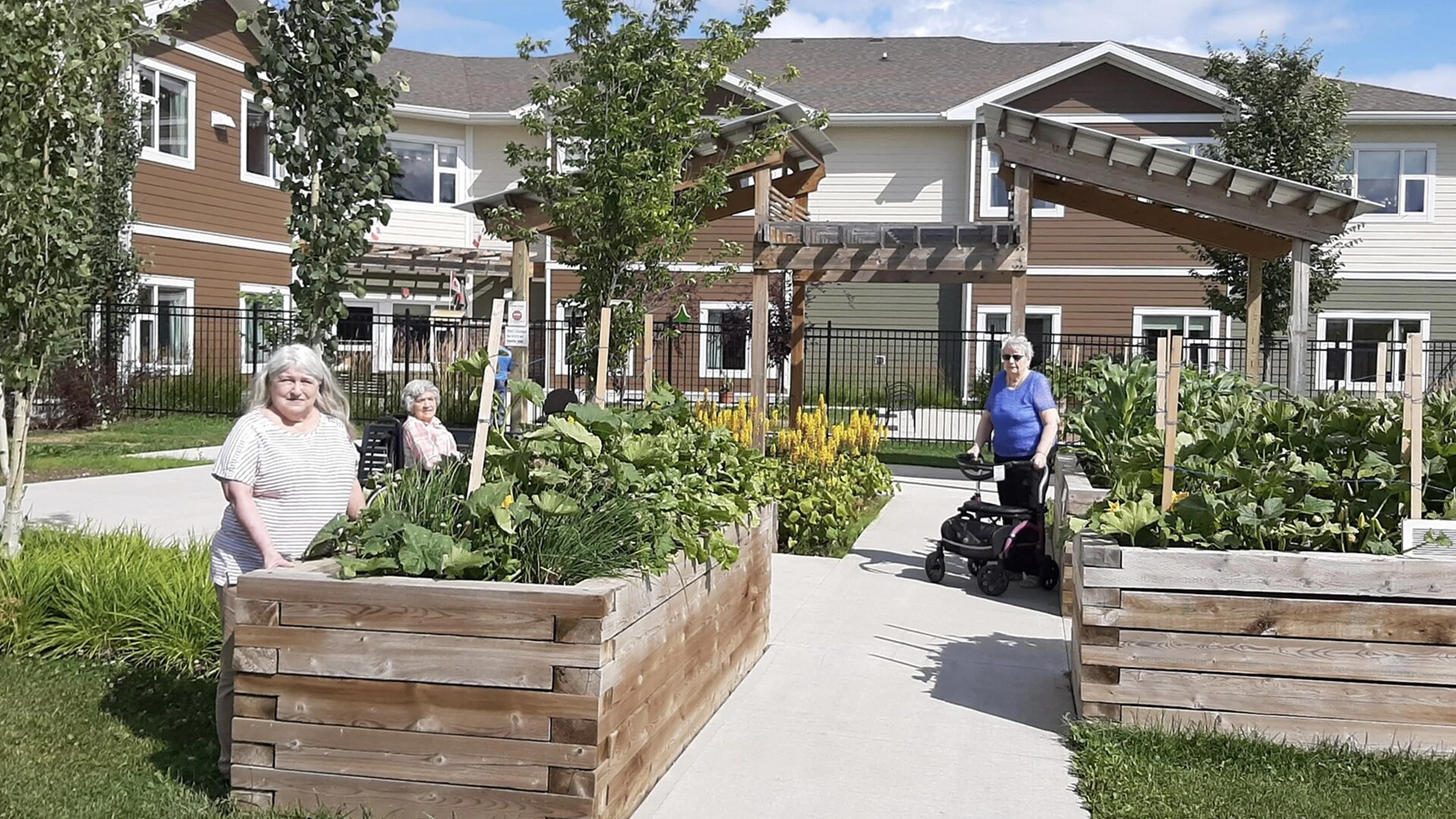 Elderly citizens gardening at Sweetgrass residence